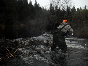 Tyler Coughlan notches a beaver dam on the Cains